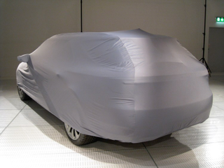 Illustration for article titled 2010 Saab 9-5 Wagon Teases In Slinky Car Cover